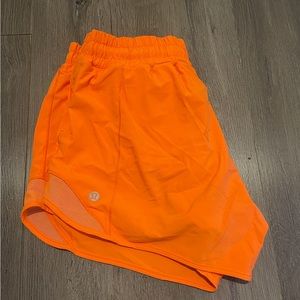 Lululemon hotty hots, high rise orange shorts, 4” size 8
